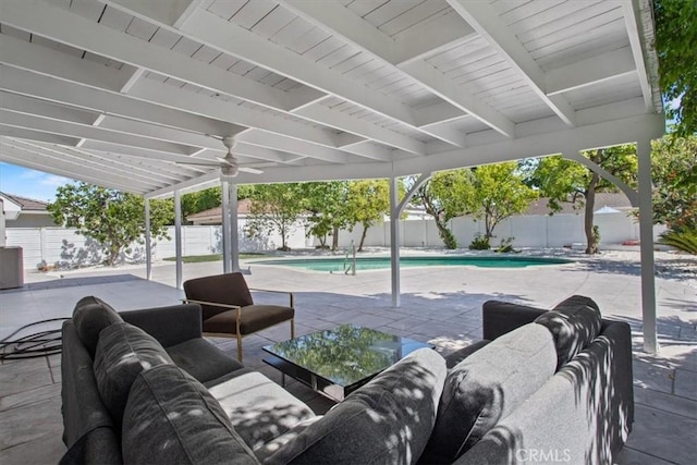 16842 Liggett St, Los Angeles, CA 91343 - fenced backyard with a patio, ceiling fan, and an outdoor hangout area