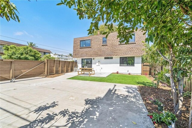 33871 Copper Lantern St, Dana Point, CA 92629 - rear view of property featuring a fenced backyard, a patio, stucco siding, and a gate