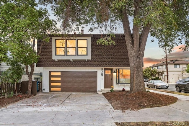 33871 Copper Lantern St, Dana Point, CA 92629 - view of front facade with an attached garage, driveway, and roof with shingles