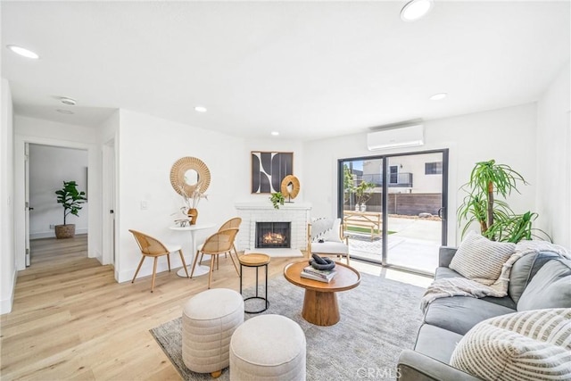 33871 Copper Lantern St, Dana Point, CA 92629 - living area with a wall mounted AC, wood finished floors, a brick fireplace, and recessed lighting