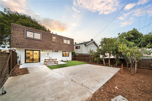 33871 Copper Lantern St, Dana Point, CA 92629 - back of property with a patio, a fenced backyard, roof with shingles, and mansard roof