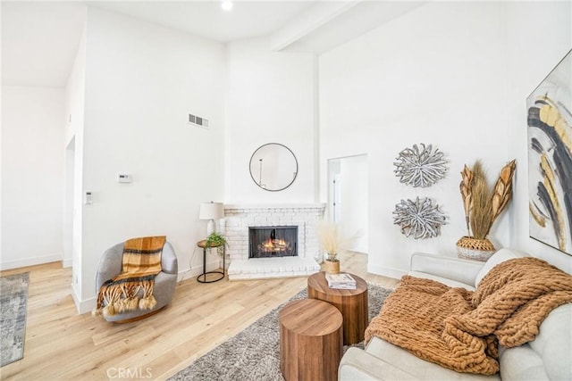 33871 Copper Lantern St, Dana Point, CA 92629 - living room featuring wood finished floors, a high ceiling, a fireplace, and recessed lighting