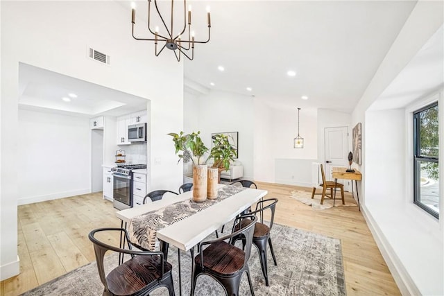 33871 Copper Lantern St, Dana Point, CA 92629 - dining room with light wood-style floors, recessed lighting, a chandelier, and a towering ceiling