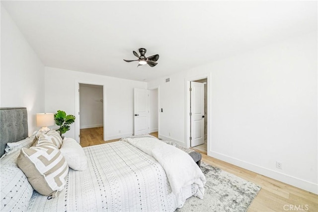 33871 Copper Lantern St, Dana Point, CA 92629 - bedroom featuring light wood-style flooring, a spacious closet, and ceiling fan