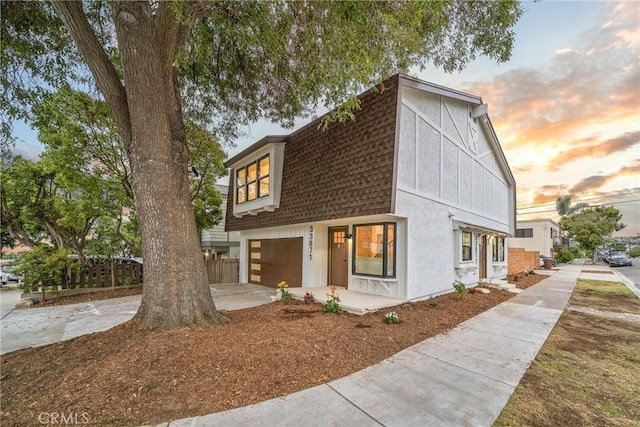 33871 Copper Lantern St, Dana Point, CA 92629 - view of front of property with a shingled roof, a gambrel roof, a garage, and driveway