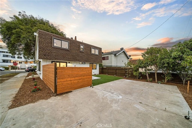 33871 Copper Lantern St, Dana Point, CA 92629 - rear view of property with mansard roof, a shingled roof, a patio area, and a chimney