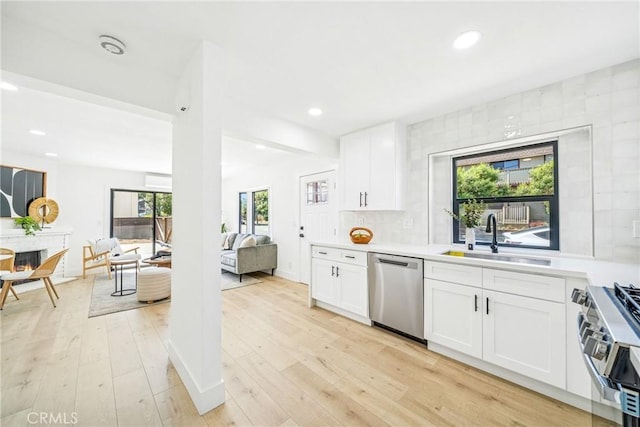 33871 Copper Lantern St, Dana Point, CA 92629 - kitchen featuring appliances with stainless steel finishes, light countertops, light wood finished floors, and recessed lighting