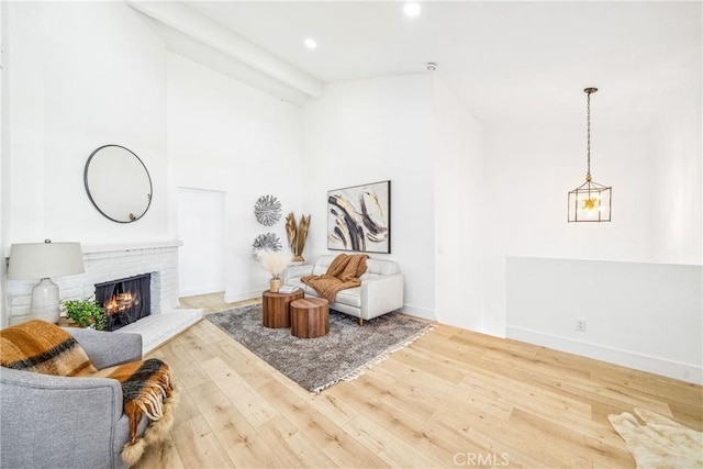 33871 Copper Lantern St, Dana Point, CA 92629 - living room featuring wood finished floors, a fireplace, high vaulted ceiling, recessed lighting, and beam ceiling