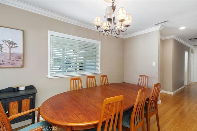 5055 Blanchard Dr, Riverside, CA 92504 - dining space with a chandelier, light wood-style floors, crown molding, and recessed lighting