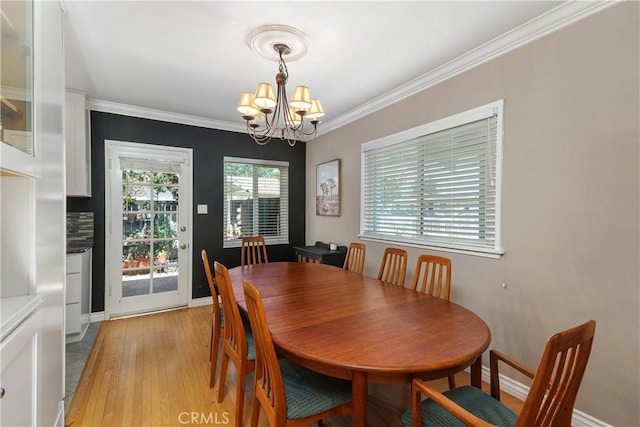 5055 Blanchard Dr, Riverside, CA 92504 - dining area featuring a chandelier, light wood finished floors, and crown molding