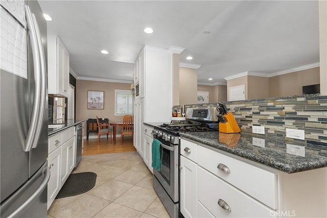 5055 Blanchard Dr, Riverside, CA 92504 - kitchen featuring stainless steel appliances, ornamental molding, white cabinetry, tasteful backsplash, and light tile patterned floors