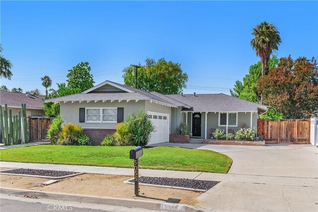 5055 Blanchard Dr, Riverside, CA 92504 - view of front facade with an attached garage, driveway, stucco siding, and roof with shingles