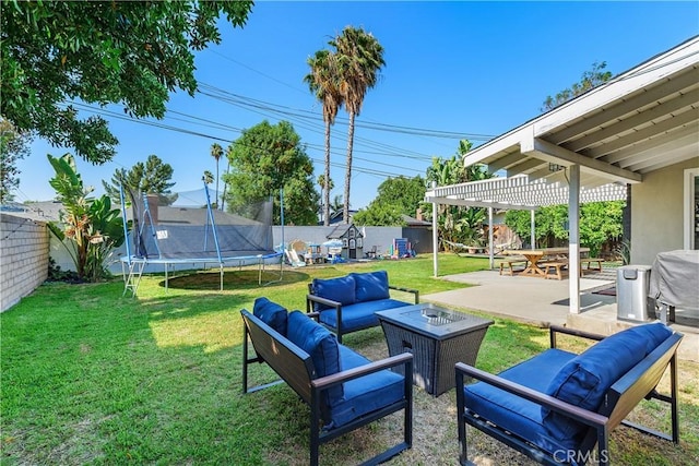5055 Blanchard Dr, Riverside, CA 92504 - fenced backyard featuring an outdoor hangout area, a trampoline, a patio area, and a pergola