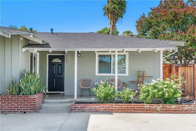 5055 Blanchard Dr, Riverside, CA 92504 - doorway to property with a shingled roof and covered porch
