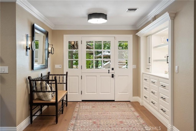 9911 Overhill Dr, North Tustin, CA 92705 - doorway to outside featuring crown molding and light wood-style floors