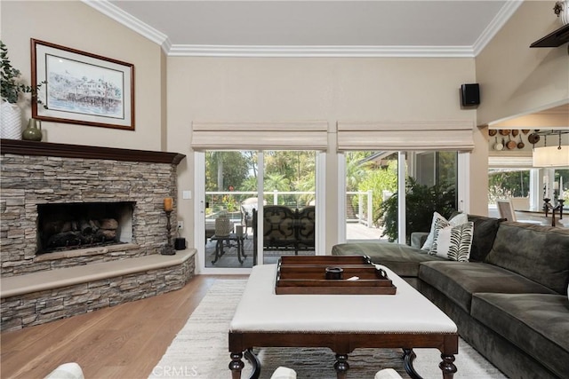 9911 Overhill Dr, North Tustin, CA 92705 - living area with crown molding, wood finished floors, a stone fireplace, and plenty of natural light