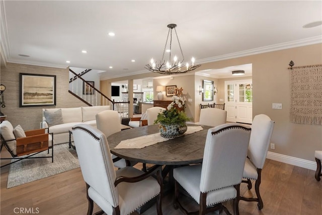 9911 Overhill Dr, North Tustin, CA 92705 - dining room with light wood finished floors, ornamental molding, recessed lighting, stairway, and a chandelier