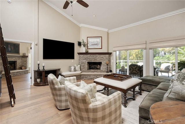 9911 Overhill Dr, North Tustin, CA 92705 - living area featuring a stone fireplace, ceiling fan, plenty of natural light, crown molding, and high vaulted ceiling