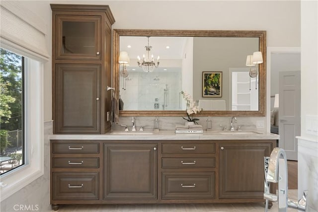 9911 Overhill Dr, North Tustin, CA 92705 - full bathroom featuring a shower stall, double vanity, and a chandelier