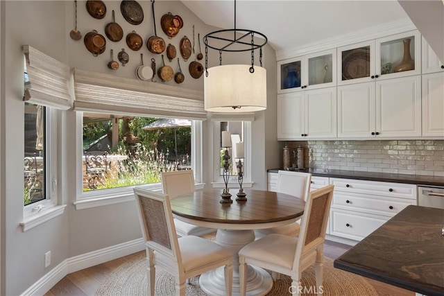 9911 Overhill Dr, North Tustin, CA 92705 - dining area with lofted ceiling and light wood finished floors