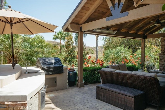 9911 Overhill Dr, North Tustin, CA 92705 - view of patio / terrace with an outdoor kitchen, a gazebo, a ceiling fan, and outdoor lounge area