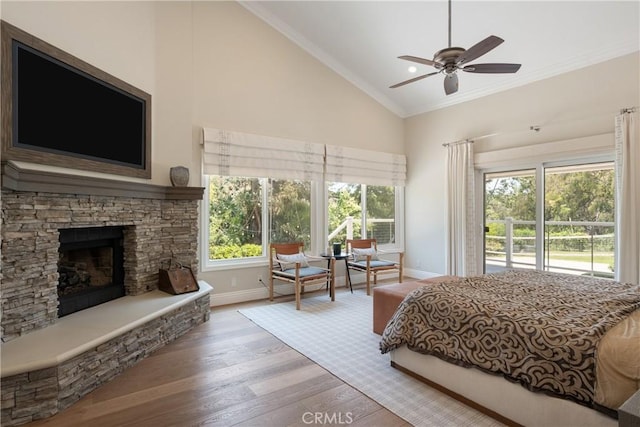 9911 Overhill Dr, North Tustin, CA 92705 - bedroom featuring vaulted ceiling, wood finished floors, a fireplace, crown molding, and ceiling fan
