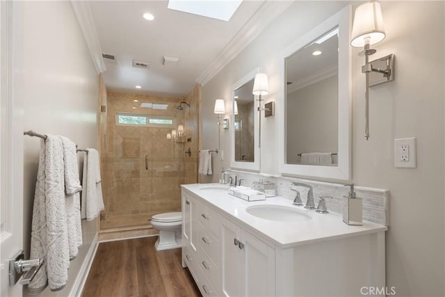 9911 Overhill Dr, North Tustin, CA 92705 - full bathroom featuring ornamental molding, a shower stall, double vanity, wood finished floors, and recessed lighting