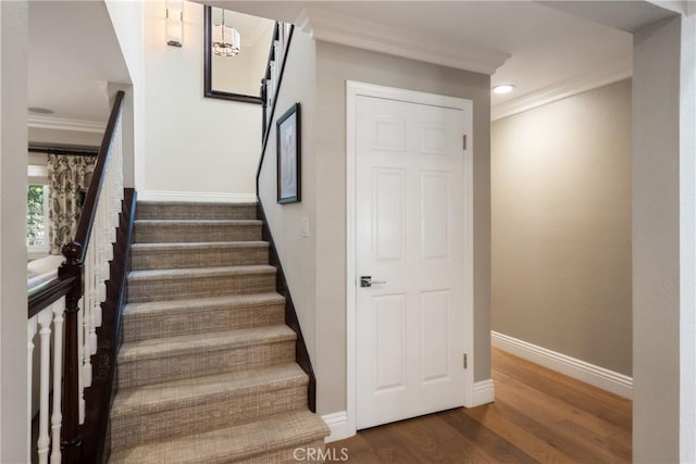 9911 Overhill Dr, North Tustin, CA 92705 - staircase with crown molding, wood finished floors, and recessed lighting