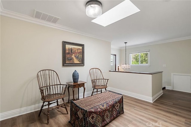 9911 Overhill Dr, North Tustin, CA 92705 - living area with ornamental molding, wood finished floors, and a skylight