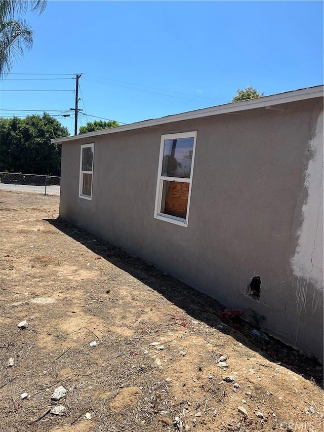 10976 Bushnell Ave, Riverside, CA 92505 - view of home's exterior featuring stucco siding