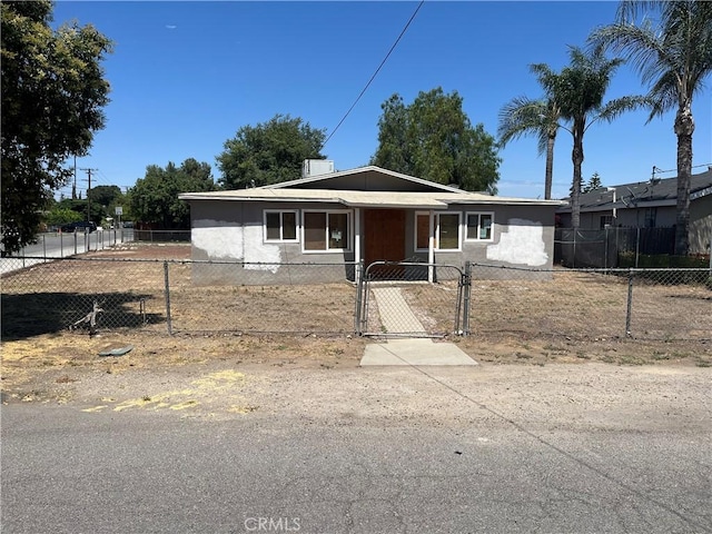 10976 Bushnell Ave, Riverside, CA 92505 - view of front of house with a fenced front yard and a gate