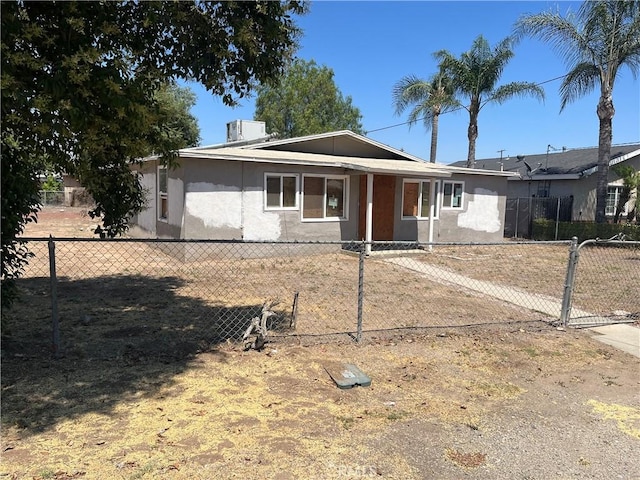 10976 Bushnell Ave, Riverside, CA 92505 - ranch-style house featuring stucco siding and a gate