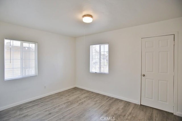 531 W 61st St, Los Angeles, CA 90044 - spare room with wood finished floors and baseboards