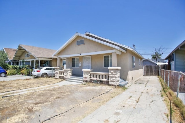 531 W 61st St, Los Angeles, CA 90044 - bungalow-style home with a porch and stucco siding