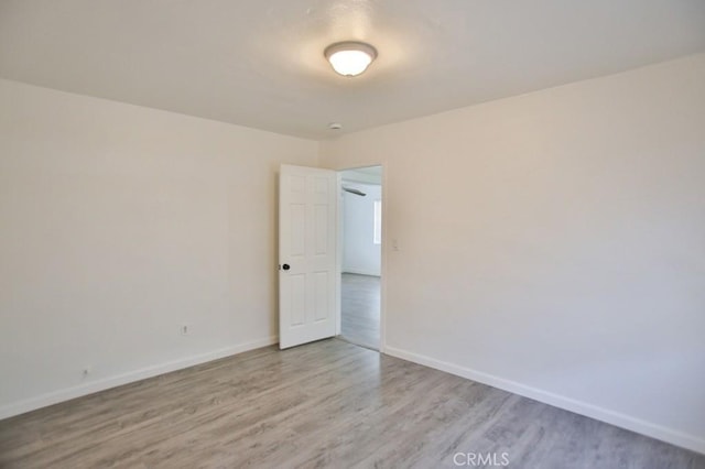 531 W 61st St, Los Angeles, CA 90044 - empty room with wood finished floors and baseboards