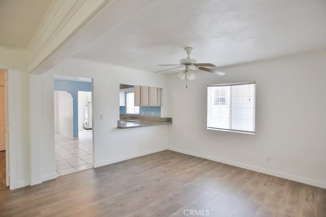 531 W 61st St, Los Angeles, CA 90044 - unfurnished living room with a ceiling fan and wood finished floors