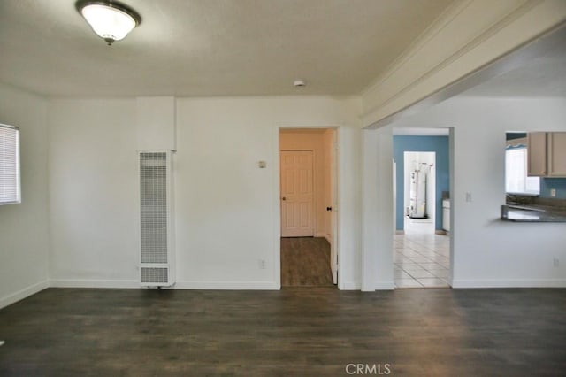 531 W 61st St, Los Angeles, CA 90044 - empty room with a heating unit and wood finished floors