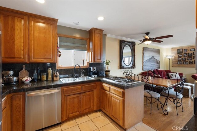 729 Longfellow Ave, Hermosa Beach, CA 90254 - kitchen featuring appliances with stainless steel finishes, brown cabinets, and recessed lighting