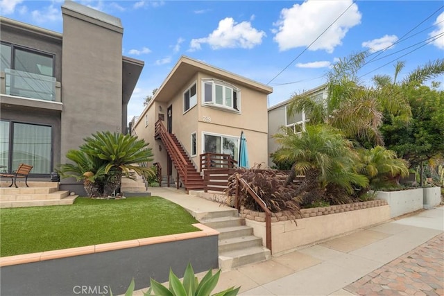 729 Longfellow Ave, Hermosa Beach, CA 90254 - view of front of home featuring stairs, stucco siding, and a front yard