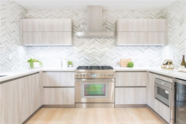 539 Avon Ave, Pasadena, CA 91105 - kitchen featuring high end stainless steel range, wall chimney range hood, and modern cabinets