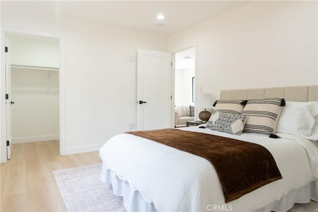 539 Avon Ave, Pasadena, CA 91105 - bedroom featuring light wood-style floors, a walk in closet, a closet, and recessed lighting