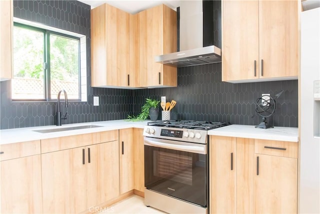 539 Avon Ave, Pasadena, CA 91105 - kitchen with light brown cabinets, wall chimney range hood, gas stove, and light countertops
