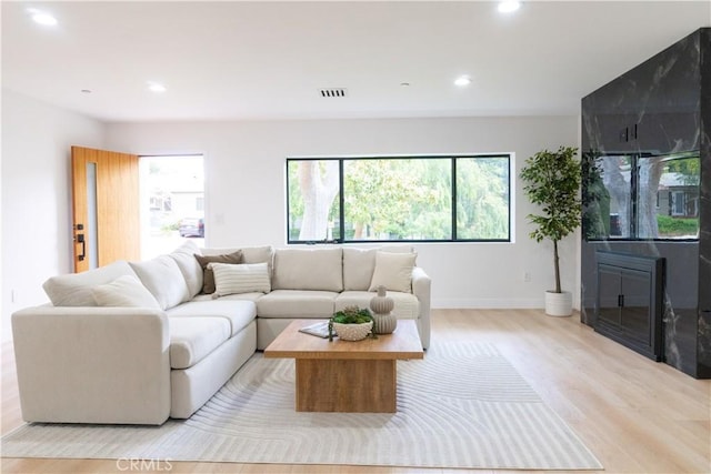 539 Avon Ave, Pasadena, CA 91105 - living room with light wood-style flooring, recessed lighting, and plenty of natural light