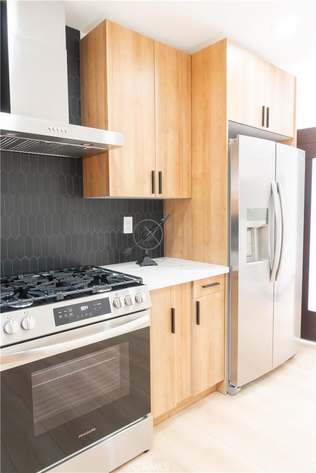 539 Avon Ave, Pasadena, CA 91105 - kitchen featuring appliances with stainless steel finishes, wall chimney range hood, light brown cabinetry, and backsplash