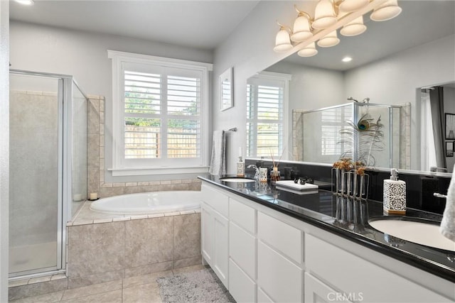 3109 Rae Creek Dr, Chico, CA 95973 - bathroom with tile patterned flooring, double vanity, a shower stall, a garden tub, and recessed lighting