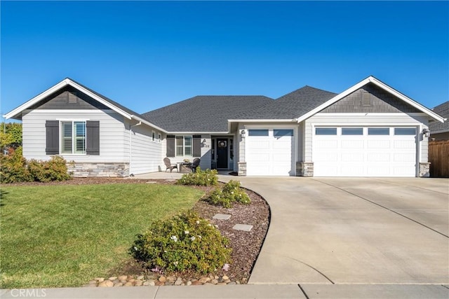 3109 Rae Creek Dr, Chico, CA 95973 - single story home featuring an attached garage, stone siding, driveway, and a front yard