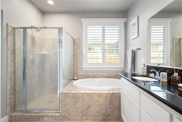 3109 Rae Creek Dr, Chico, CA 95973 - full bath featuring vanity, a shower stall, a garden tub, tile patterned flooring, and recessed lighting