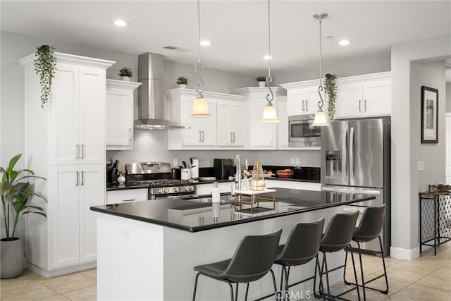 3109 Rae Creek Dr, Chico, CA 95973 - kitchen with wall chimney exhaust hood, appliances with stainless steel finishes, dark countertops, light tile patterned flooring, and white cabinetry