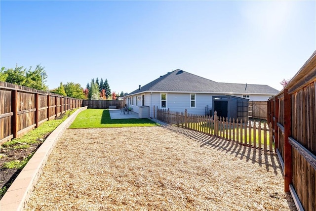 3109 Rae Creek Dr, Chico, CA 95973 - rear view of house with a storage shed, a fenced backyard, and a patio area