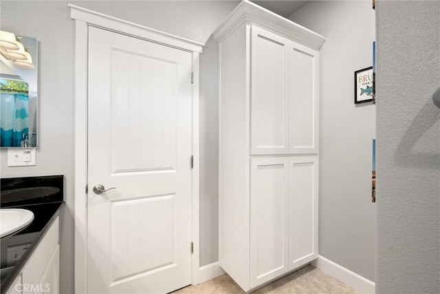 3109 Rae Creek Dr, Chico, CA 95973 - bathroom with double vanity and baseboards
